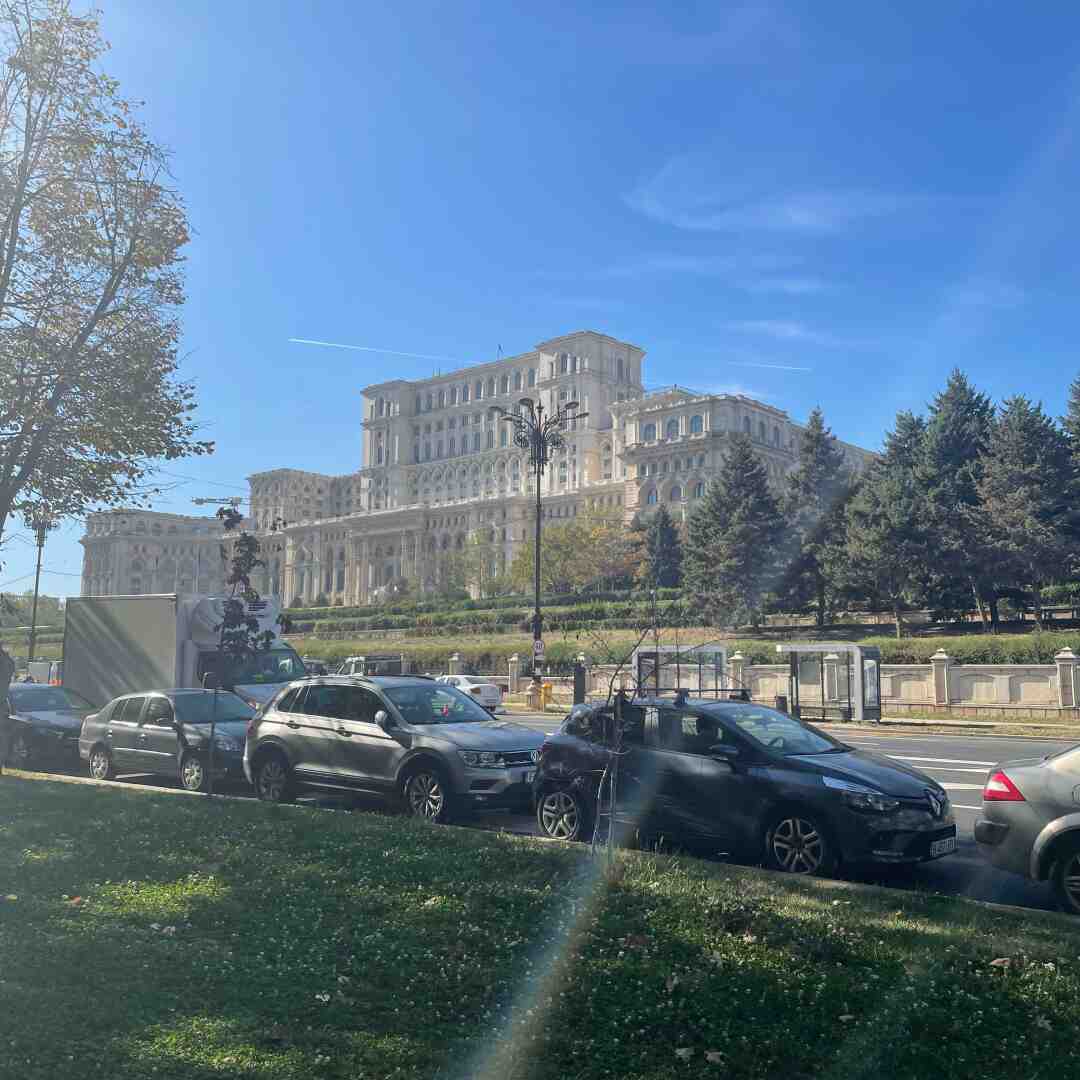 The Palace of Parliament, located in Bucharest, Romania, is one of the largest administrative buildings globally. Built during the communist era, it's known for its monumental scale and neoclassical design. Covering 365,000 sqm, it houses Romania's Parliament and various government offices. Controversial for its construction's impact on the city, it's a major tourist attraction today, offering tours of its opulent interiors. It's often considered the heaviest building worldwide, weighing around 4.1 million metric tons.