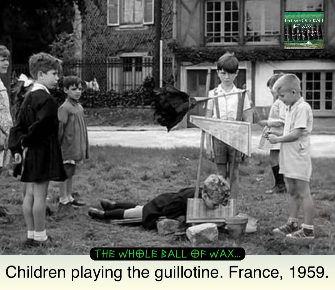 Children playing the guillotine. France, 1959.