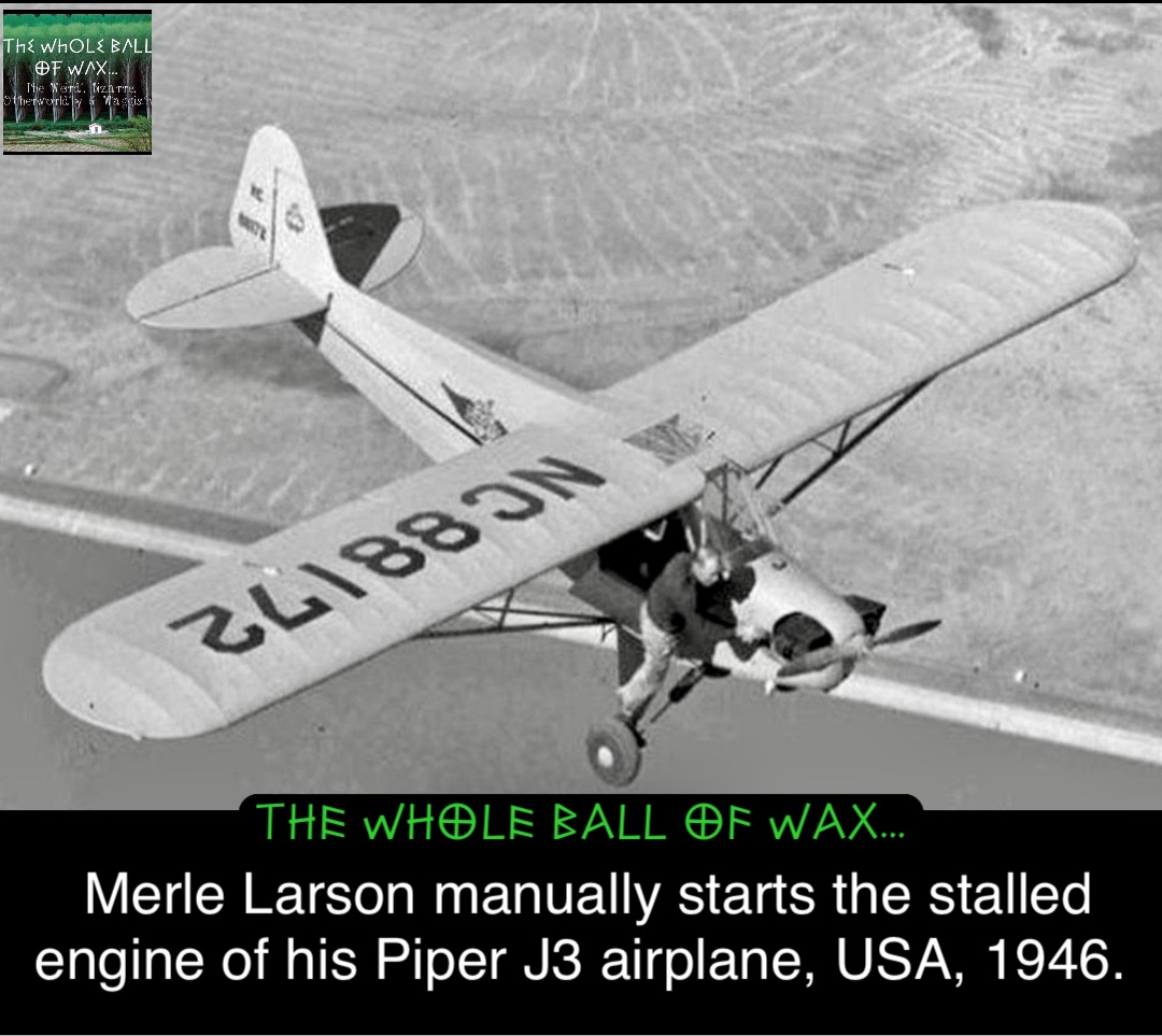 Double tap to edit Merle Larson manually starts the stalled engine of his Piper J3 airplane, USA, 1946.