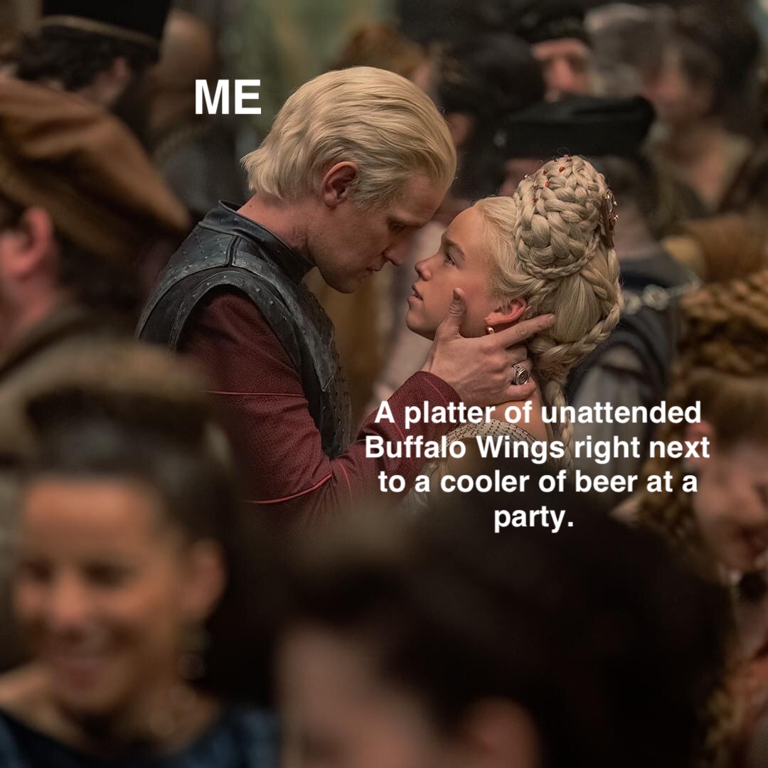 ME A platter of unattended Buffalo Wings right next to a cooler of beer at a party.